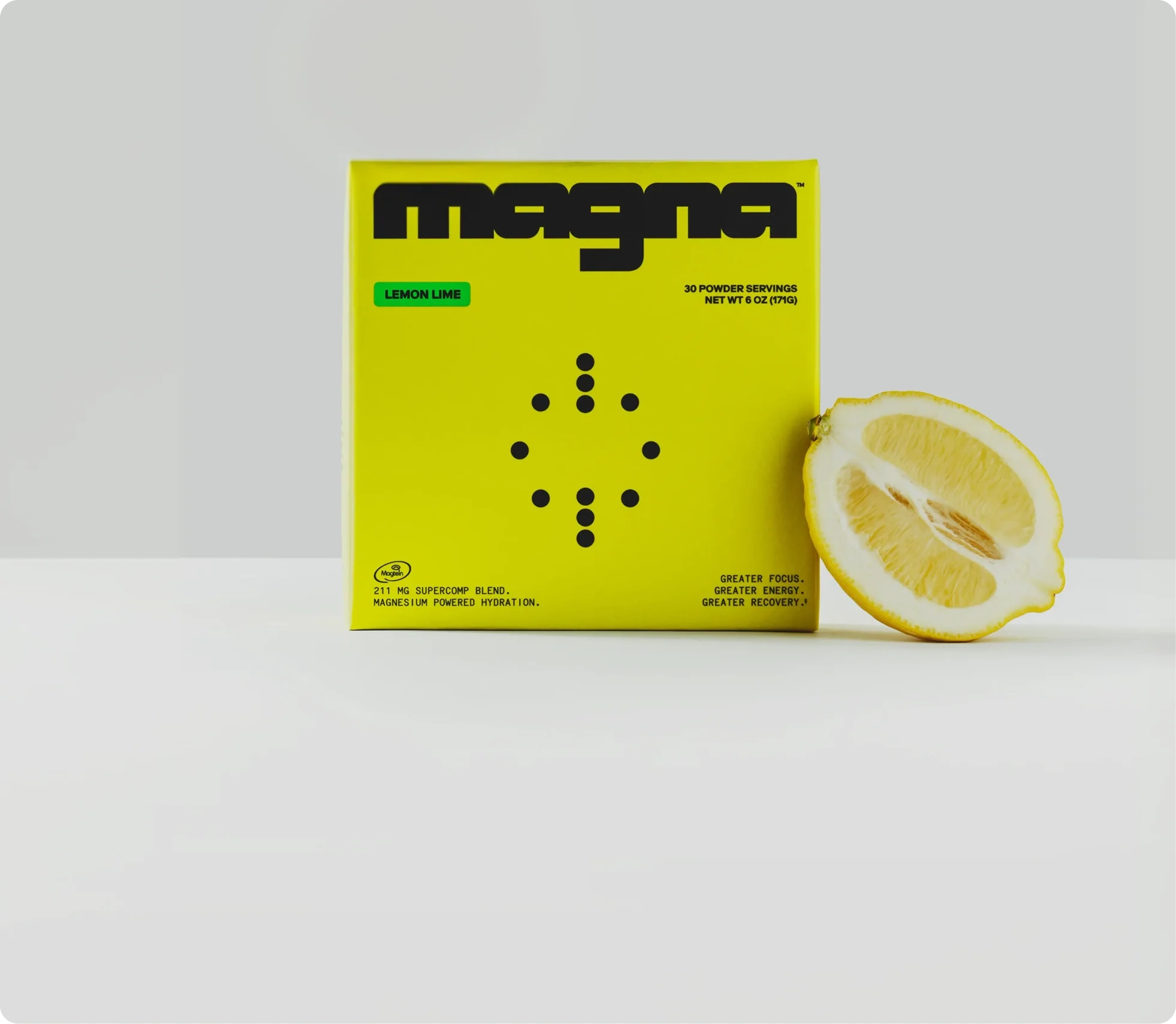 Yellow magna Lemon Lime box beside half a lemon
