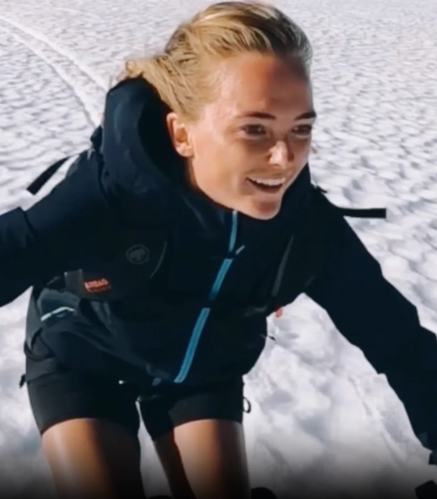 Skier smiling on a snowy slope